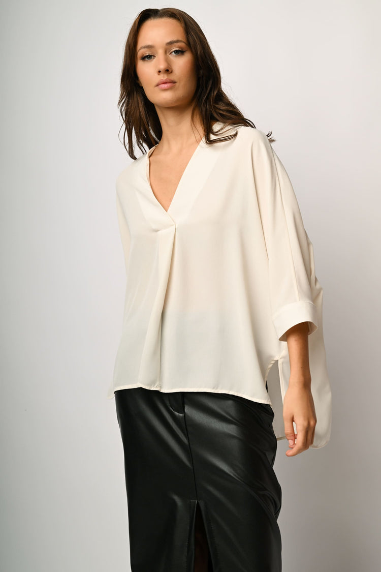 Blusa asimmetrica con scollo a V