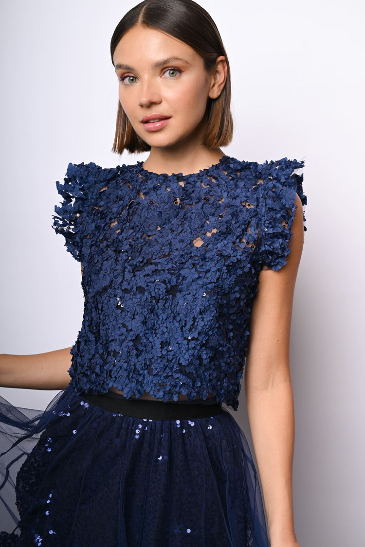 Top crop in pizzo floreale con paillettes