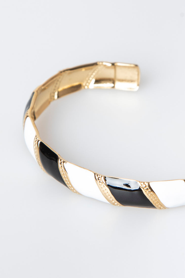 Bracciale rigido a bande diagonali