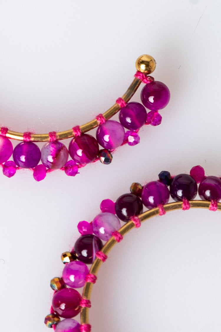 Orecchini a semicerchio con perline