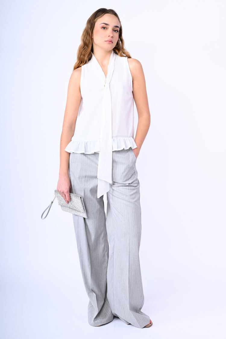 Top con fiocco e volant