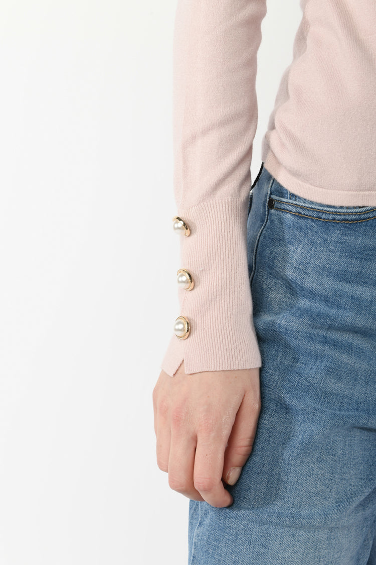 Pull con bottoni gioiello