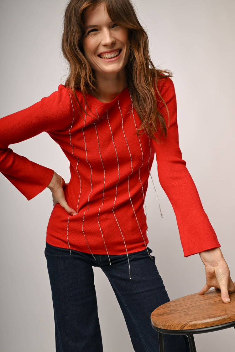 Pull con fili pendenti in strass