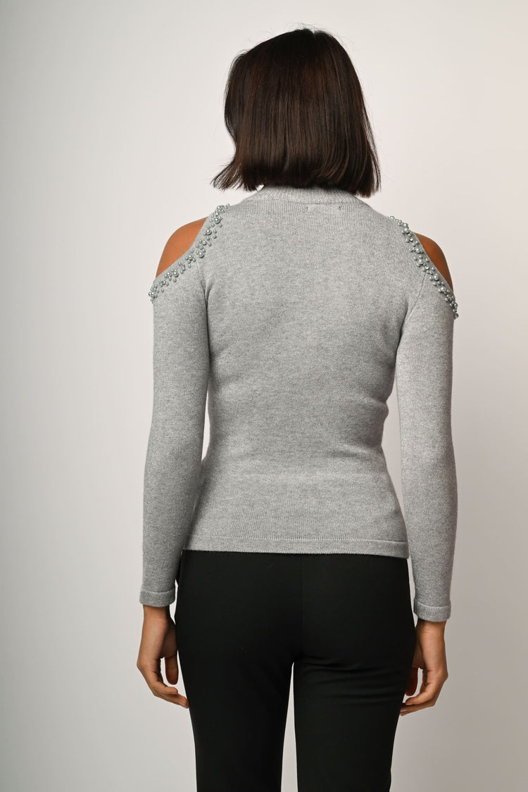 Lupetto con cut-outs e perline