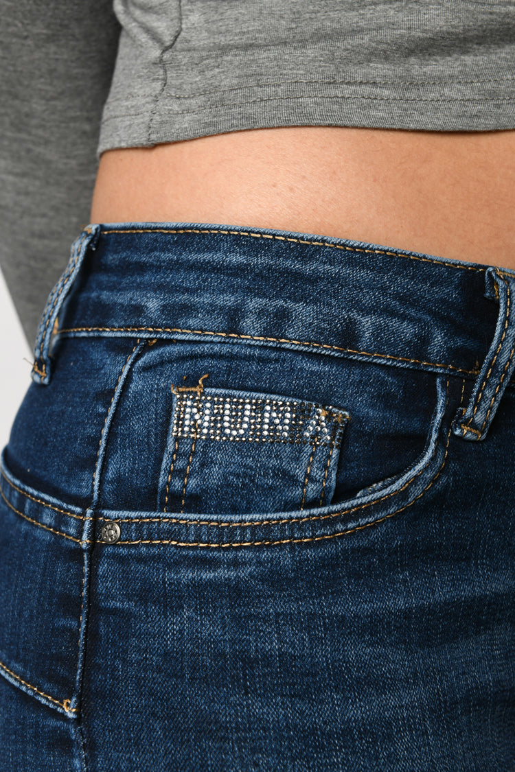 Jeans skinny con strass sulle tasche