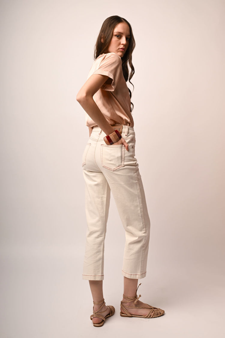 Jeans con impunture a contrasto