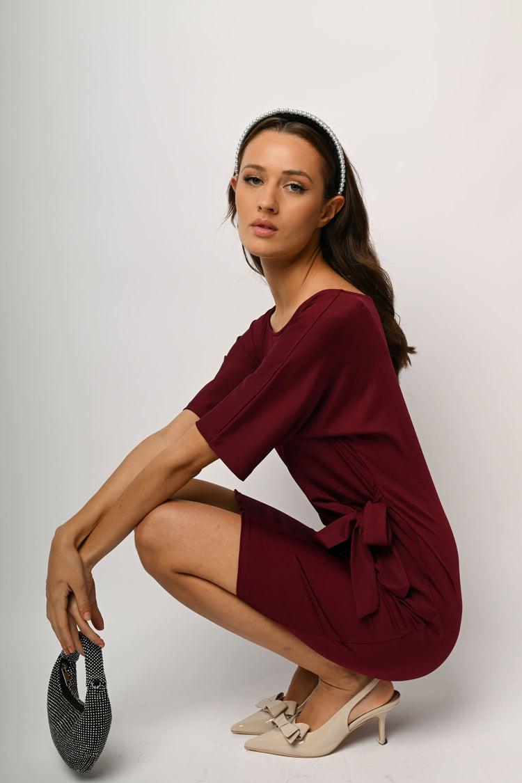 Abito con fiocco laterale