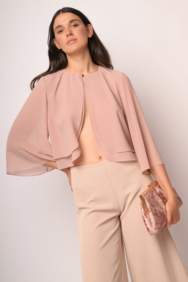 Bolero rosa con bottone e maniche a mantella