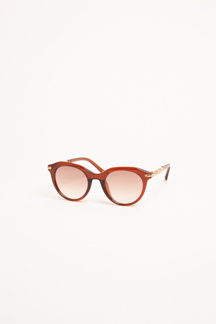 Occhiale da sole rotondi rosso mattone con strass