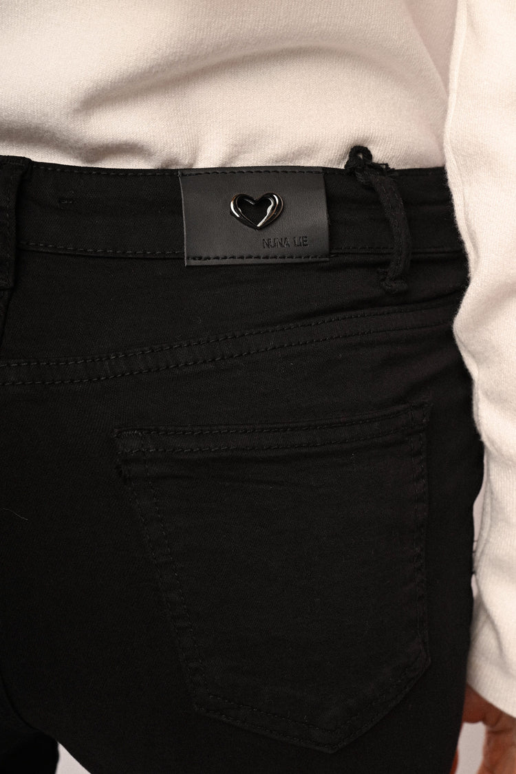 Jeans skinny con bottoni gioiello