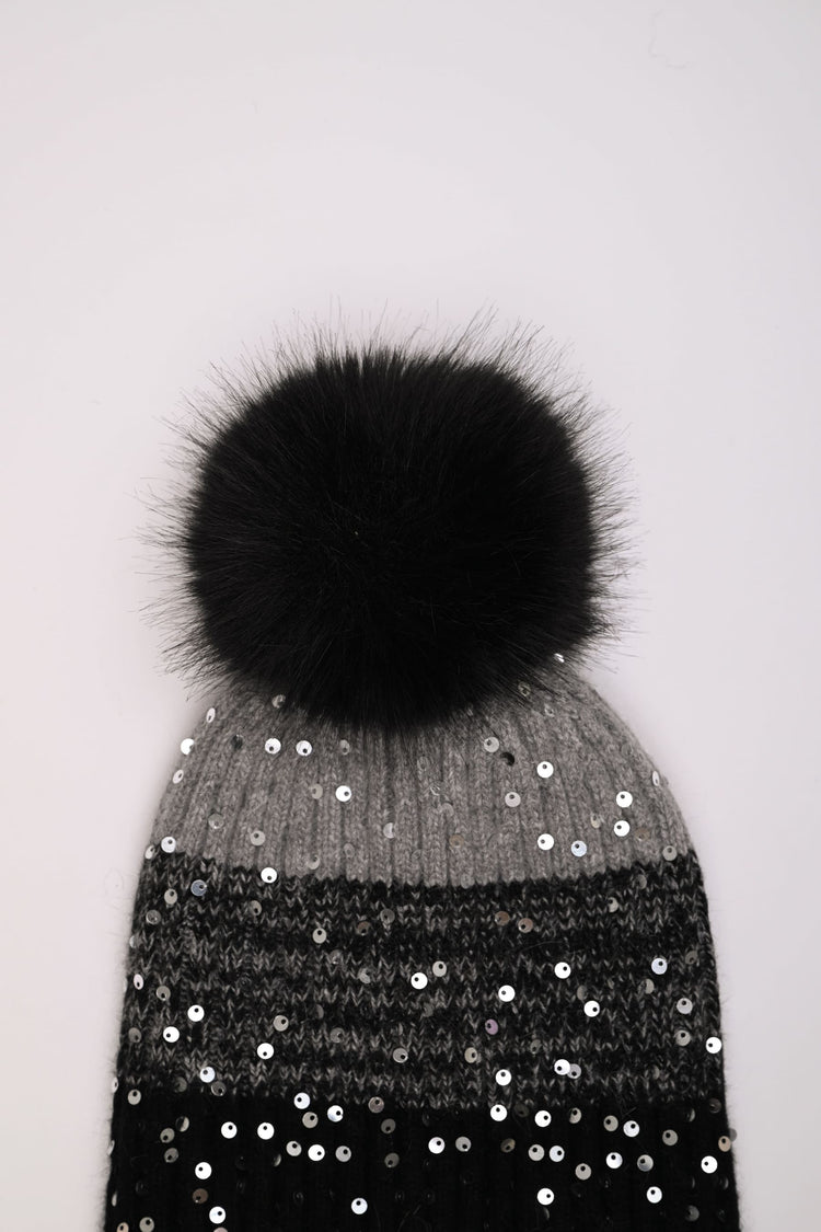 Berretto color-block con paillettes e pompon