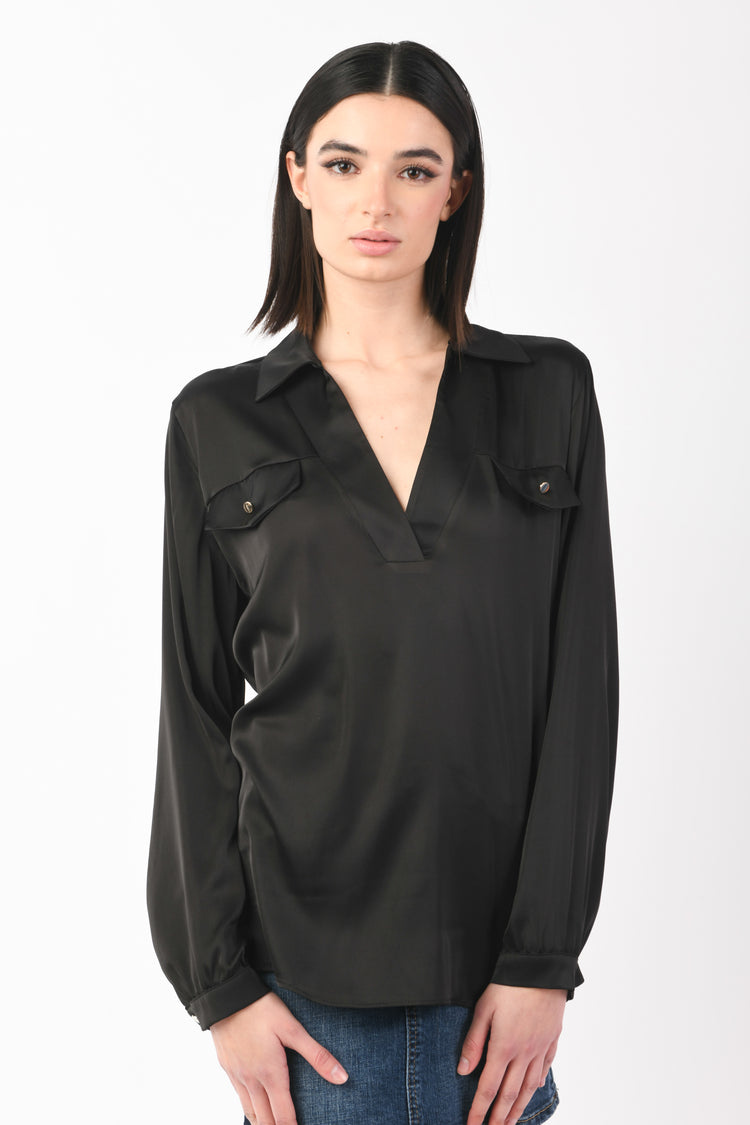 Blusa con taschini