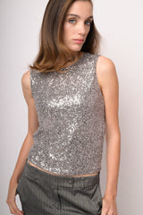 Top smanicato con paillettes argento