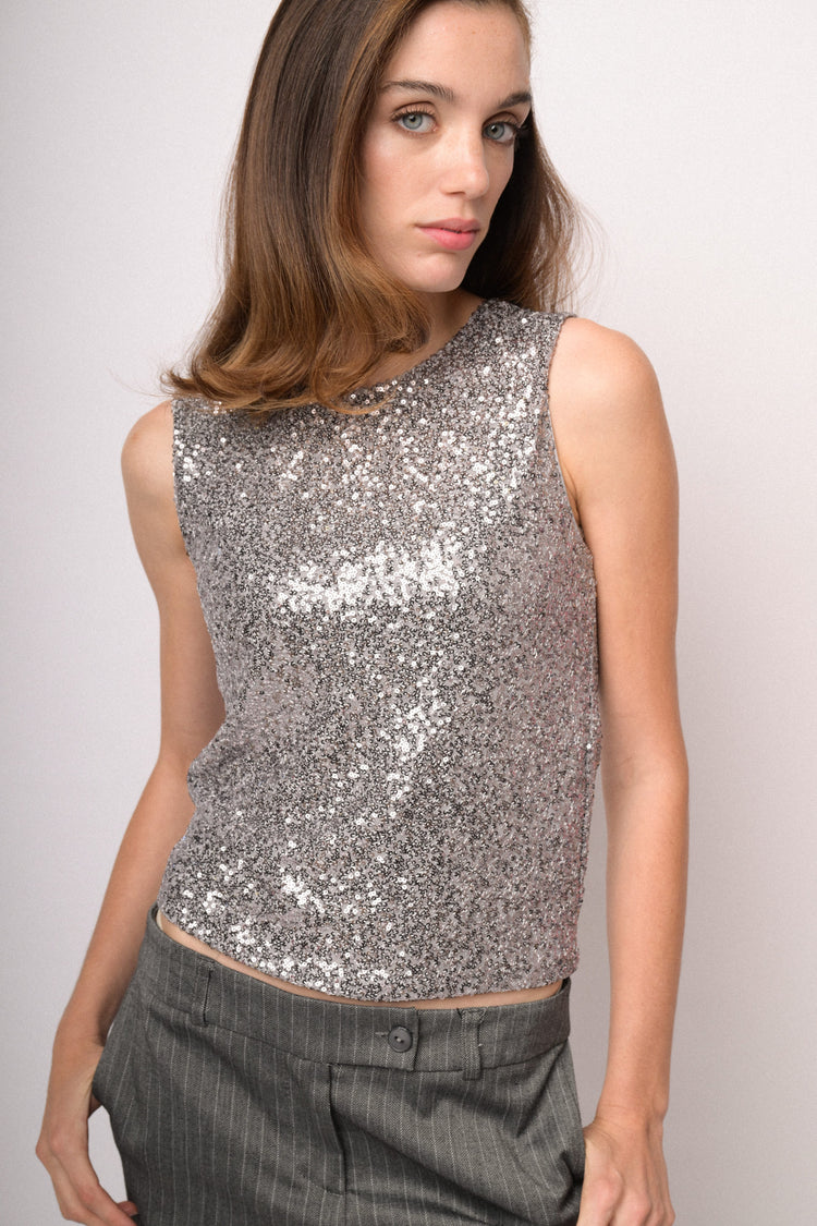 Top smanicato con paillettes argento