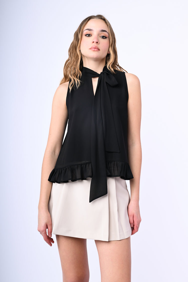 Top con fiocco e volant