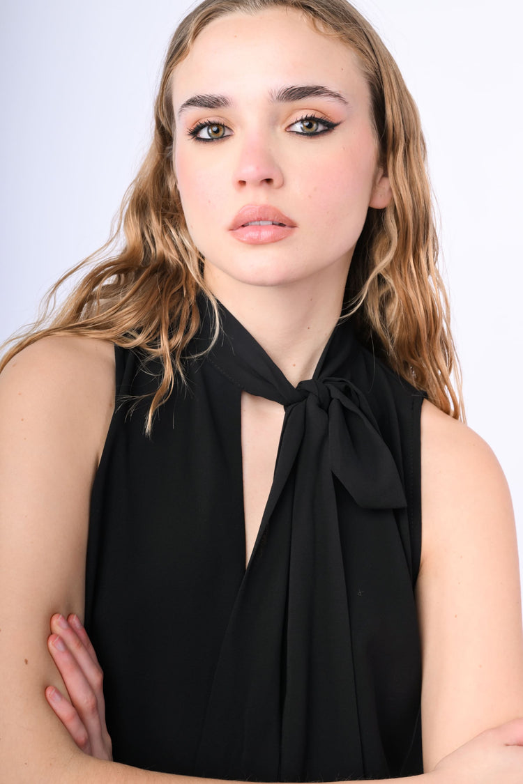 Top con fiocco e volant