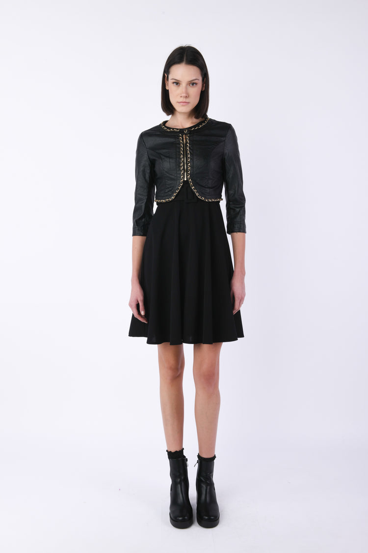 Giacca in similpelle con catenelle