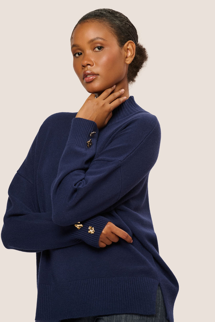 Lupetto con bottoni gioiello ai polsini