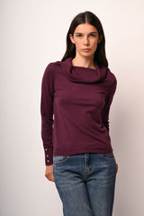 Pull con bottoni gioiello ai polsini
