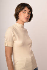 Maglia con fiocco perline manica