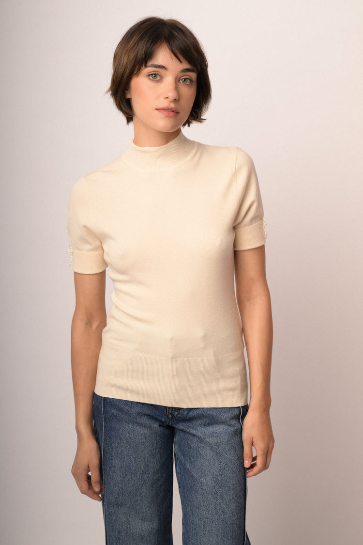Maglia con fiocco perline manica
