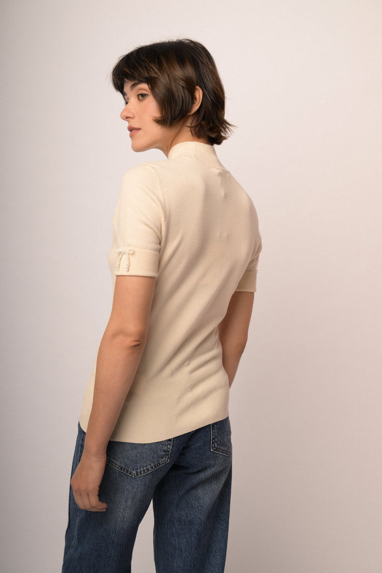 Maglia con fiocco perline manica
