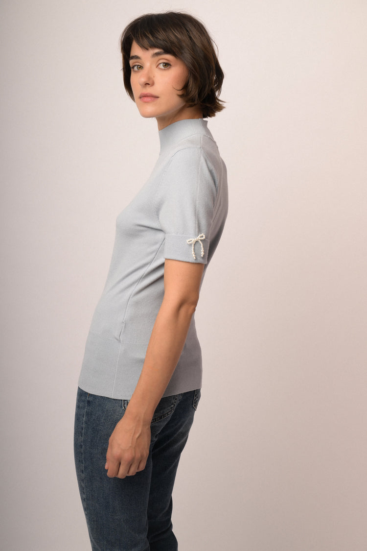 Maglia con fiocco perline manica