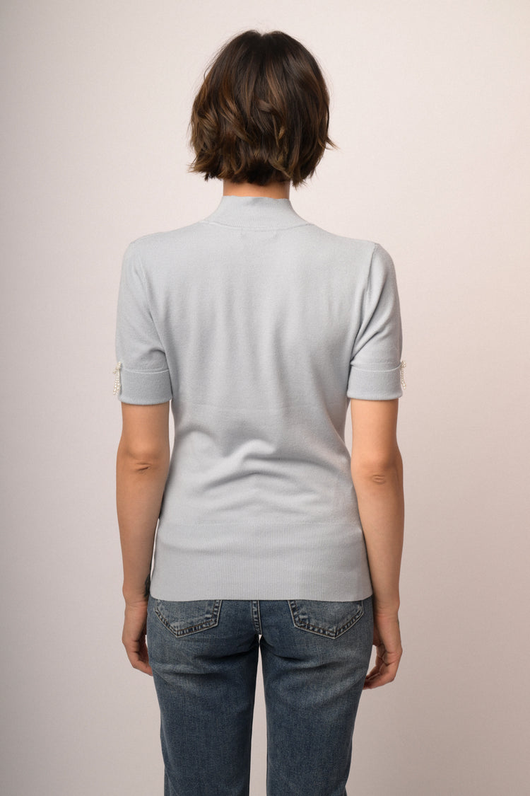 Maglia con fiocco perline manica