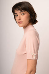 Maglia con fiocco perline manica