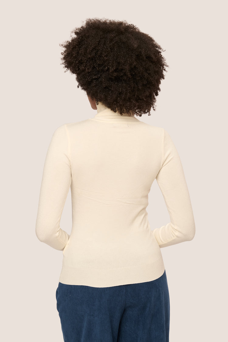 Dolcevita con bottoni ai polsini