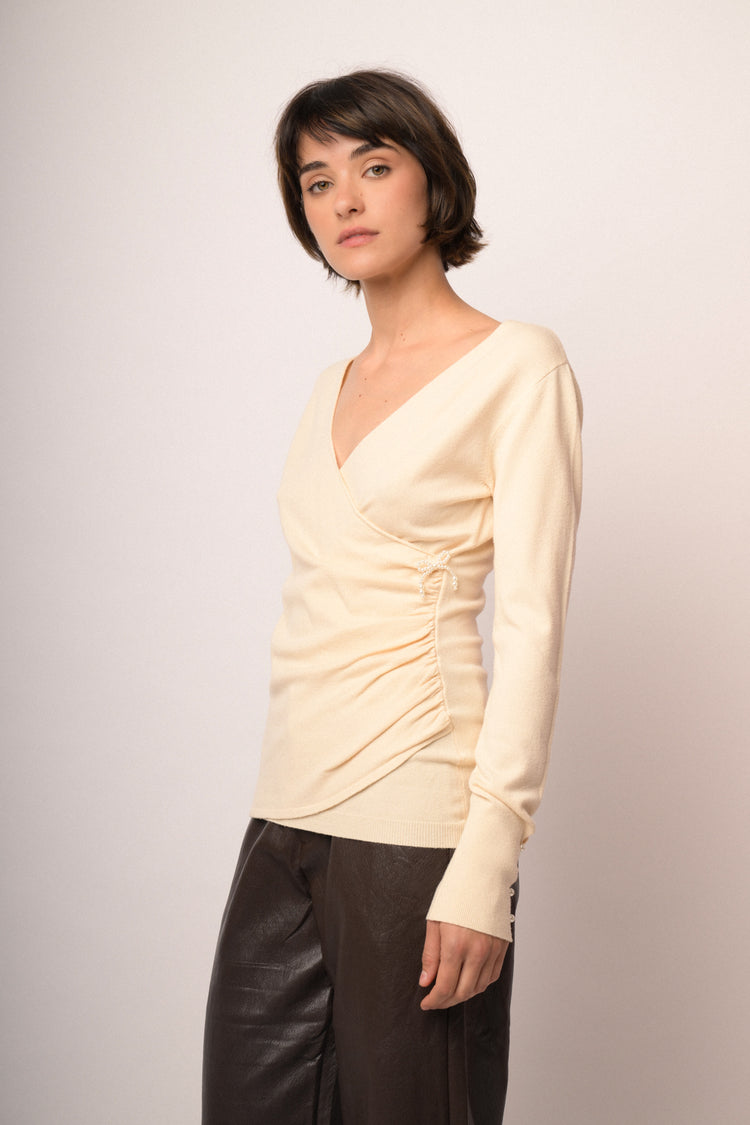 Maglia incrocio con fiocchi perline
