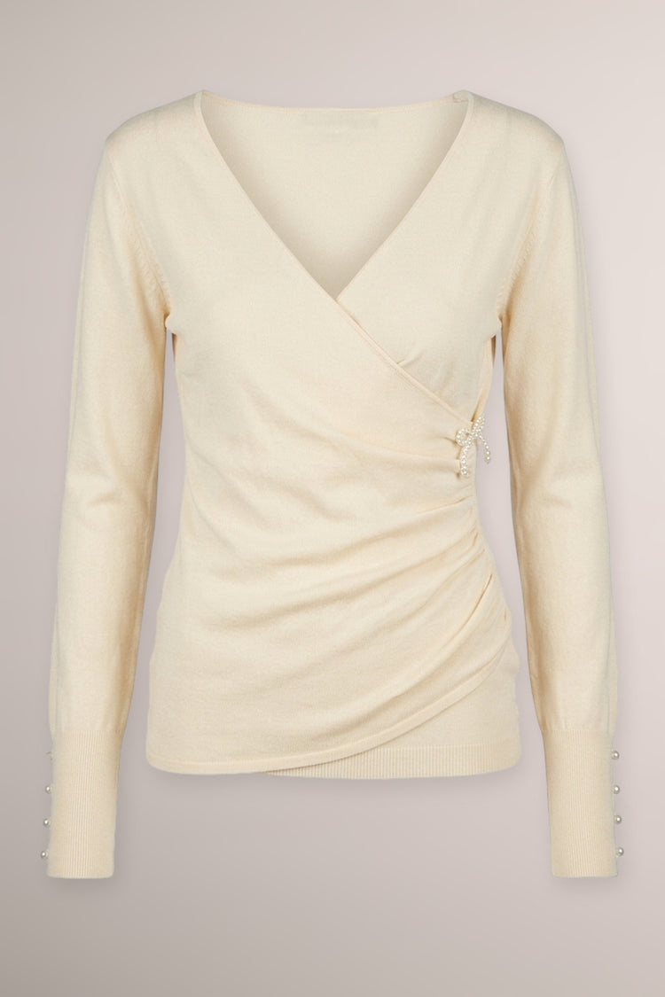 Pull incrociato avorio con fiocchetto in perline