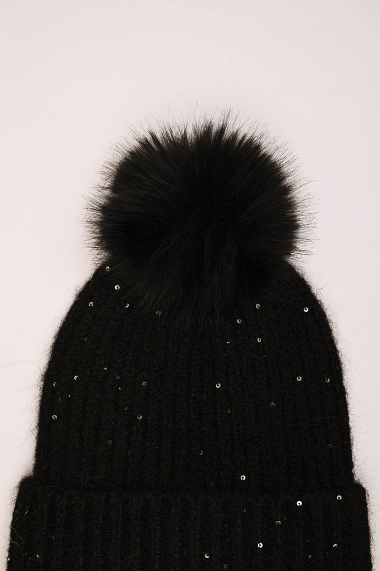 Berretto con pompon e paillettes