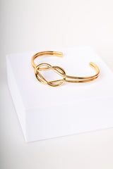 Bracciale rigido con intreccio