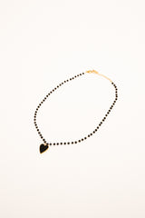 Collana con perline e pendente a cuore nero