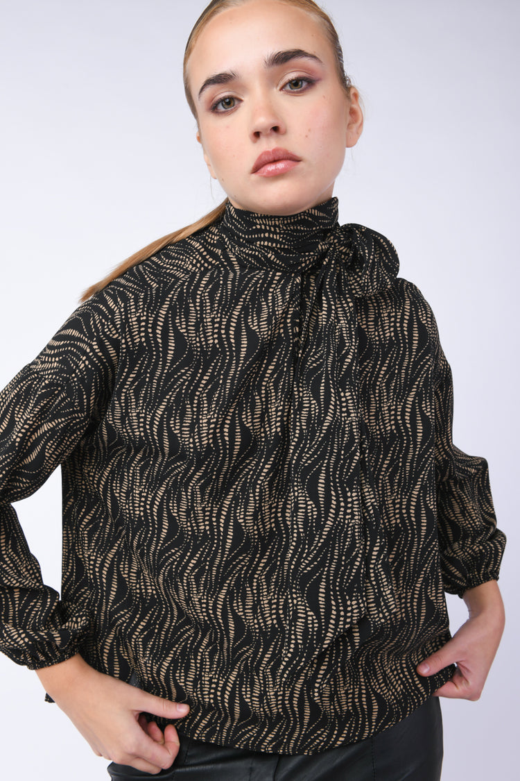 Blusa con stampa e fiocco